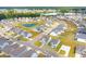Aerial view of a neighborhood with houses and a lake at 780 Opal Wing St, Moncks Corner, SC 29461