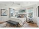 Bright bedroom with a king-size bed and hardwood floors at 780 Opal Wing St, Moncks Corner, SC 29461