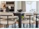 Modern dark wood dining table with six light-colored cushioned chairs at 780 Opal Wing St, Moncks Corner, SC 29461