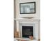Elegant fireplace with white mantel and marble surround at 780 Opal Wing St, Moncks Corner, SC 29461