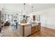 Modern kitchen with an island, stainless steel appliances, and hardwood floors at 780 Opal Wing St, Moncks Corner, SC 29461