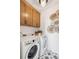 Bright laundry room with washer, dryer, and stylish cabinets at 780 Opal Wing St, Moncks Corner, SC 29461