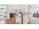 Upstairs hallway with hardwood floors and views into rooms and sitting area at 780 Opal Wing St, Moncks Corner, SC 29461