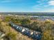 Aerial view of townhouses and surrounding landscape at 8202 S Antler Dr, North Charleston, SC 29406