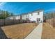 Fenced backyard with patio, seating, and grill at 8202 S Antler Dr, North Charleston, SC 29406