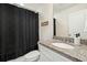 Clean bathroom with granite countertop, shower/tub combo, and white vanity at 8202 S Antler Dr, North Charleston, SC 29406