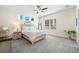 Bright bedroom with carpeted floor, queen-size bed, and neutral color palette at 8202 S Antler Dr, North Charleston, SC 29406