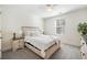 Cozy bedroom with a queen bed, nightstands, and ceiling fan at 8202 S Antler Dr, North Charleston, SC 29406