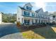 Two story home with front porch and landscaping at 8202 S Antler Dr, North Charleston, SC 29406