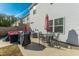 Outdoor patio with seating area, grill, and umbrella at 8202 S Antler Dr, North Charleston, SC 29406