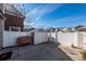 Backyard with patio, shed, grill, and white fence at 826 Rue Dr, Charleston, SC 29414
