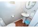 Small powder room with pedestal sink and toilet at 826 Rue Dr, Charleston, SC 29414