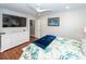 Spacious bedroom with large TV, dresser, and ceiling fan at 826 Rue Dr, Charleston, SC 29414