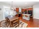 Spacious dining area with wood table and chairs near kitchen at 826 Rue Dr, Charleston, SC 29414
