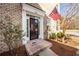 Front door with welcoming mat and American flag at 826 Rue Dr, Charleston, SC 29414