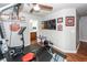 Home gym with weight machine, exercise bike, and bathroom access at 826 Rue Dr, Charleston, SC 29414