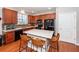 Modern kitchen featuring wood cabinets, granite countertops, and island at 826 Rue Dr, Charleston, SC 29414
