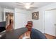 Home office with L-shaped desk, chair, and access to bedroom at 826 Rue Dr, Charleston, SC 29414