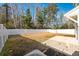 Private backyard with a wooden fence and patio at 9761 Transplanter Cir, Ladson, SC 29456