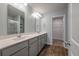 Double vanity bathroom with gray cabinets and a walk-in shower at 9761 Transplanter Cir, Ladson, SC 29456