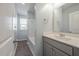 Clean bathroom, grey vanity, white countertop, and bathtub at 9761 Transplanter Cir, Ladson, SC 29456