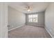 Spacious bedroom with carpeted floor and large window at 9761 Transplanter Cir, Ladson, SC 29456