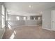 Open bonus room with carpeted floor and multiple windows at 9761 Transplanter Cir, Ladson, SC 29456