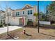 Two-story townhome with gray siding, red door, and American flag at 9761 Transplanter Cir, Ladson, SC 29456