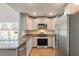 Modern kitchen with stainless steel appliances and granite counters at 9761 Transplanter Cir, Ladson, SC 29456