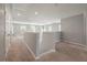 Spacious loft area with carpet and multiple windows at 9761 Transplanter Cir, Ladson, SC 29456