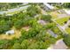 Aerial view showing homes nestled in a lush, wooded area at 1225 Central Ave, Summerville, SC 29483