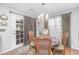 Cozy dining area, featuring a round table and chairs, and French doors to a patio at 115 Alwyn Blvd, Summerville, SC 29485