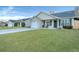 Houses with green lawns and driveways at 124 Pointer Dr, Goose Creek, SC 29445