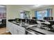 Modern kitchen features granite countertops, stainless steel appliances, and white cabinets at 124 Pointer Dr, Goose Creek, SC 29445