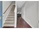Entryway with hardwood floors, carpeted stairs, and view to living area at 128 Buchanan Cir, Goose Creek, SC 29445