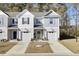 Two-story townhome with gray siding, attached garage, and landscaping at 128 Buchanan Cir, Goose Creek, SC 29445