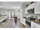 Modern kitchen with white cabinets, granite countertops, and stainless steel appliances at 128 Buchanan Cir, Goose Creek, SC 29445
