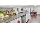 Open kitchen with granite countertops, stainless steel appliances, and hardwood floors at 128 Buchanan Cir, Goose Creek, SC 29445