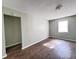 Empty bedroom with light sage walls and wood-look flooring at 1401 Rivers St, Walterboro, SC 29488
