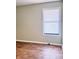 Empty bedroom with light sage walls and wood-look flooring at 1401 Rivers St, Walterboro, SC 29488