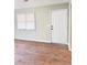 Empty entryway with light sage walls and wood-look flooring at 1401 Rivers St, Walterboro, SC 29488