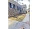 Side view of brick ranch house with walkway and landscaping at 1401 Rivers St, Walterboro, SC 29488