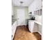 Updated kitchen with stainless steel appliances and wood-look floors at 1401 Rivers St, Walterboro, SC 29488