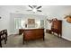 Bedroom with wooden sleigh bed and antique dresser at 1433 Martins Point Rd, Wadmalaw Island, SC 29487