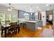 Modern kitchen with gray cabinets, large island, and stainless steel appliances at 1433 Martins Point Rd, Wadmalaw Island, SC 29487