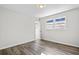 Well-lit bedroom with hardwood floors and a view of the backyard at 1439 River Front Dr, Charleston, SC 29407