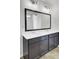 Double vanity bathroom with dark brown cabinets and a large mirror at 145 Clydesdale Cir, Summerville, SC 29486