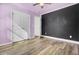 Spacious bedroom with a chalkboard wall and double doors at 145 Clydesdale Cir, Summerville, SC 29486