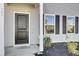 Dark brown front door with sidelights and a welcome mat at 145 Clydesdale Cir, Summerville, SC 29486