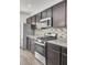 Kitchen with stainless steel appliances and dark brown cabinets at 145 Clydesdale Cir, Summerville, SC 29486